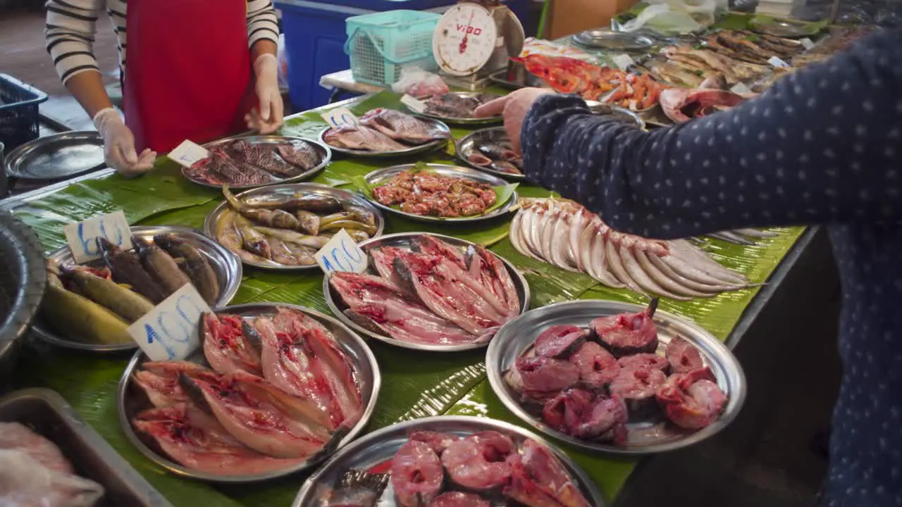 Fish being sold at Thai wet market food stall