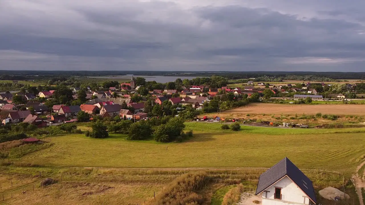 Old village by a lake and between fields