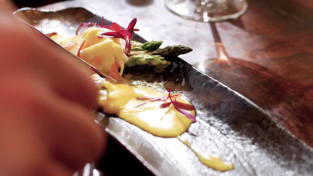 Close-up of man eating healthy meal at restaurant