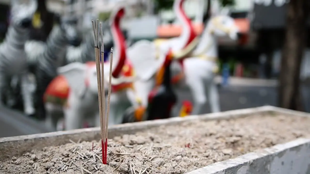 Smoking incense in a Buddhist temple