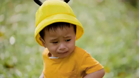 Vietnamese boy with hat like a bee