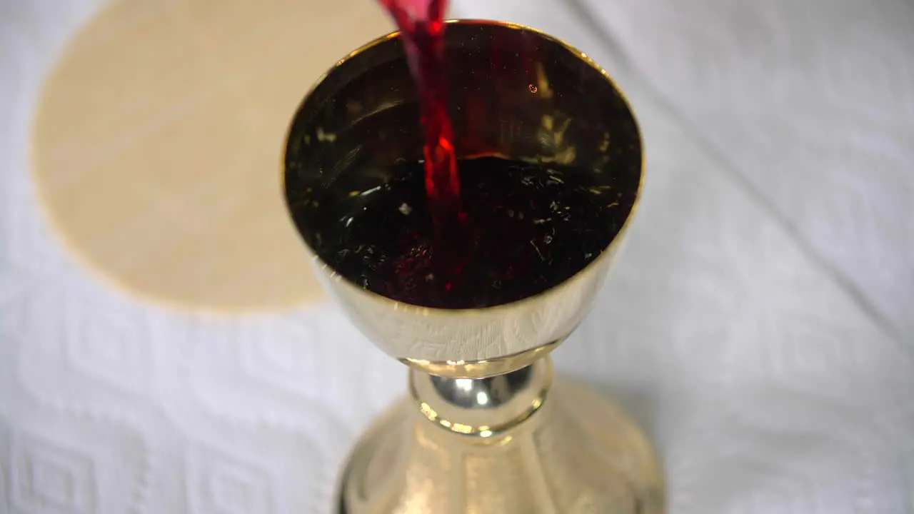 Pouring Wine Into Goblet Eucharist Cavanah Bread Communion Pope Peter Christian Catholic Episcopal Lutheran Southern Baptist Church Denomination Body Of Christ Jesus Crucifixion Savior Righteous Mass