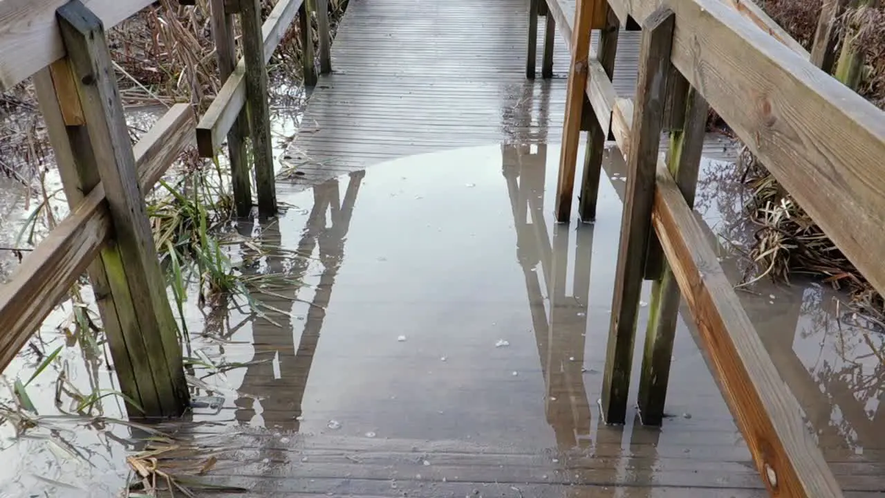 Flooded wooden bridge in january