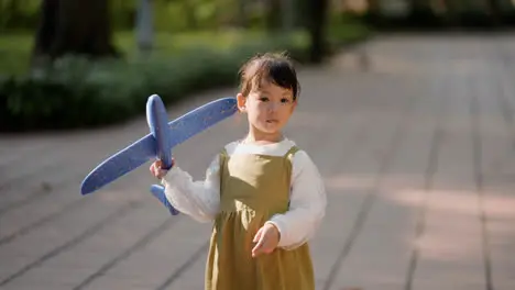 Child with blue airplane