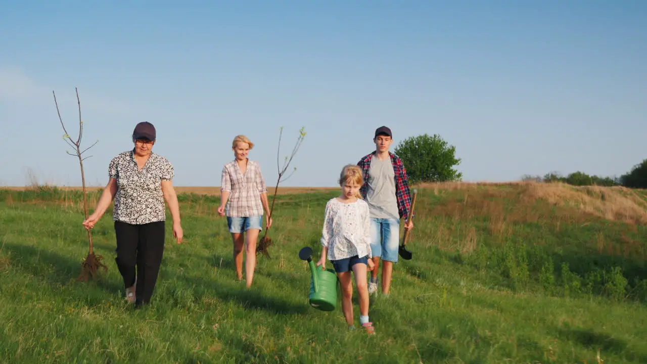 A Friendly Family Is Going To Plant A Tree