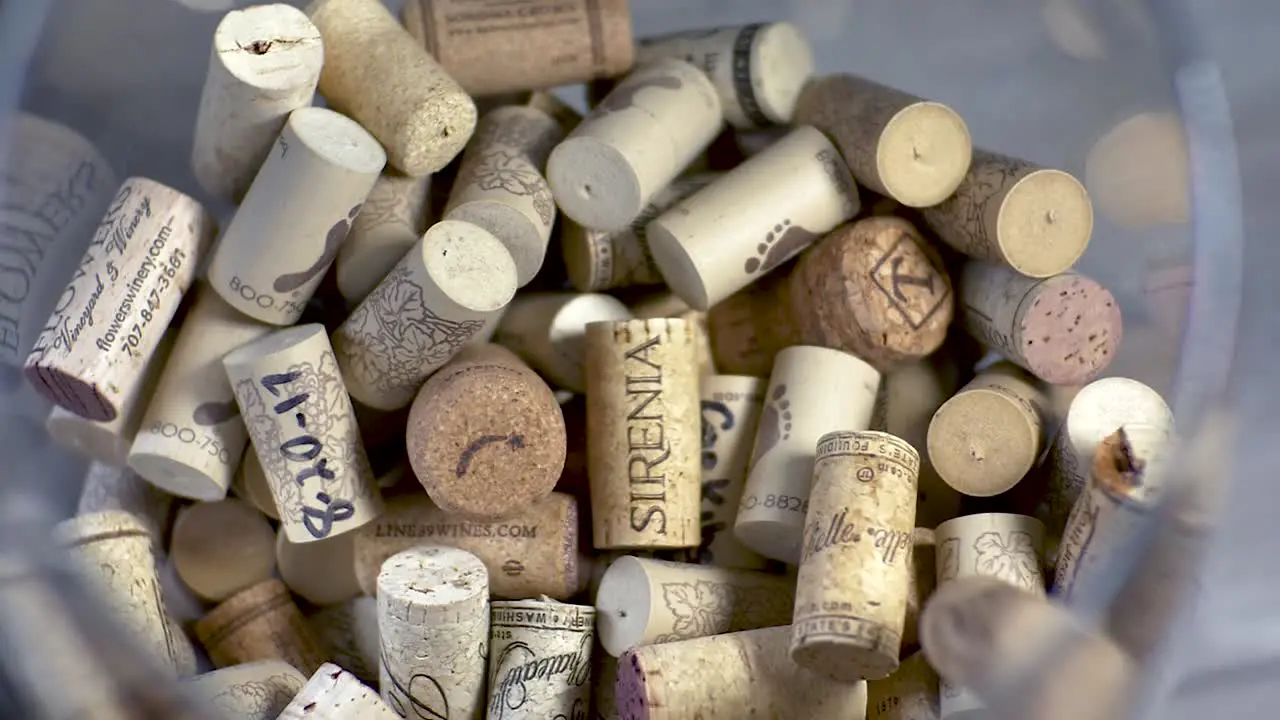 SLOMO corks droping in a glass container