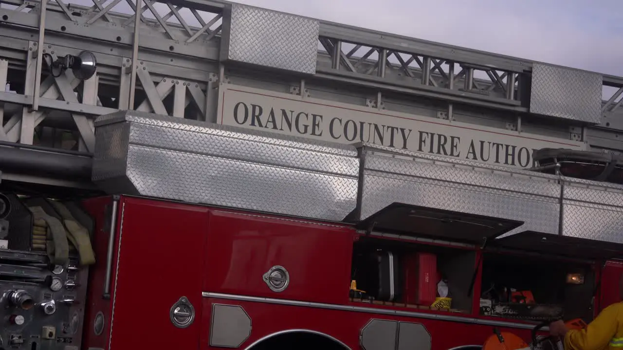 firefighters place gear in truck