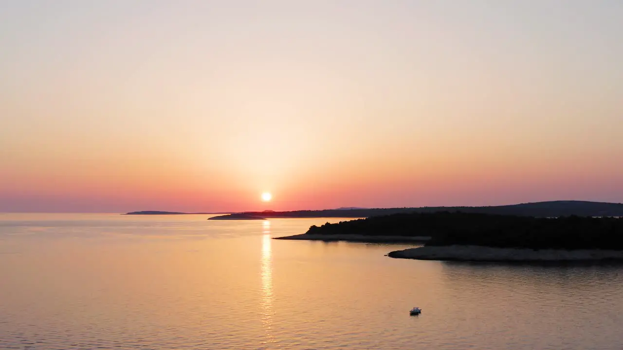 Aerial dolly shot at sunset retreating from Losinj island Croatia