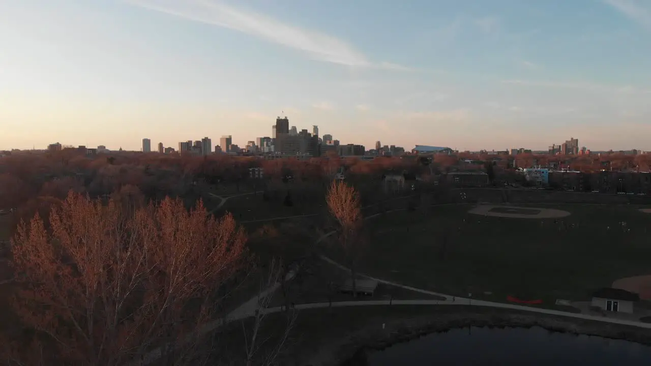 Aerial footage Minneapolis skyline during golden hour view from far away