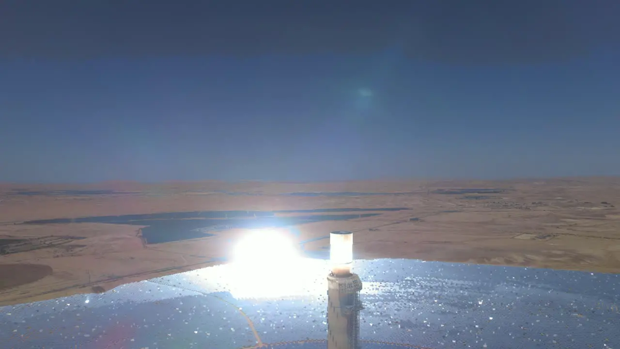 Tallest solar power tower in the world close-up view the mirrors bend the light aerial drone shot