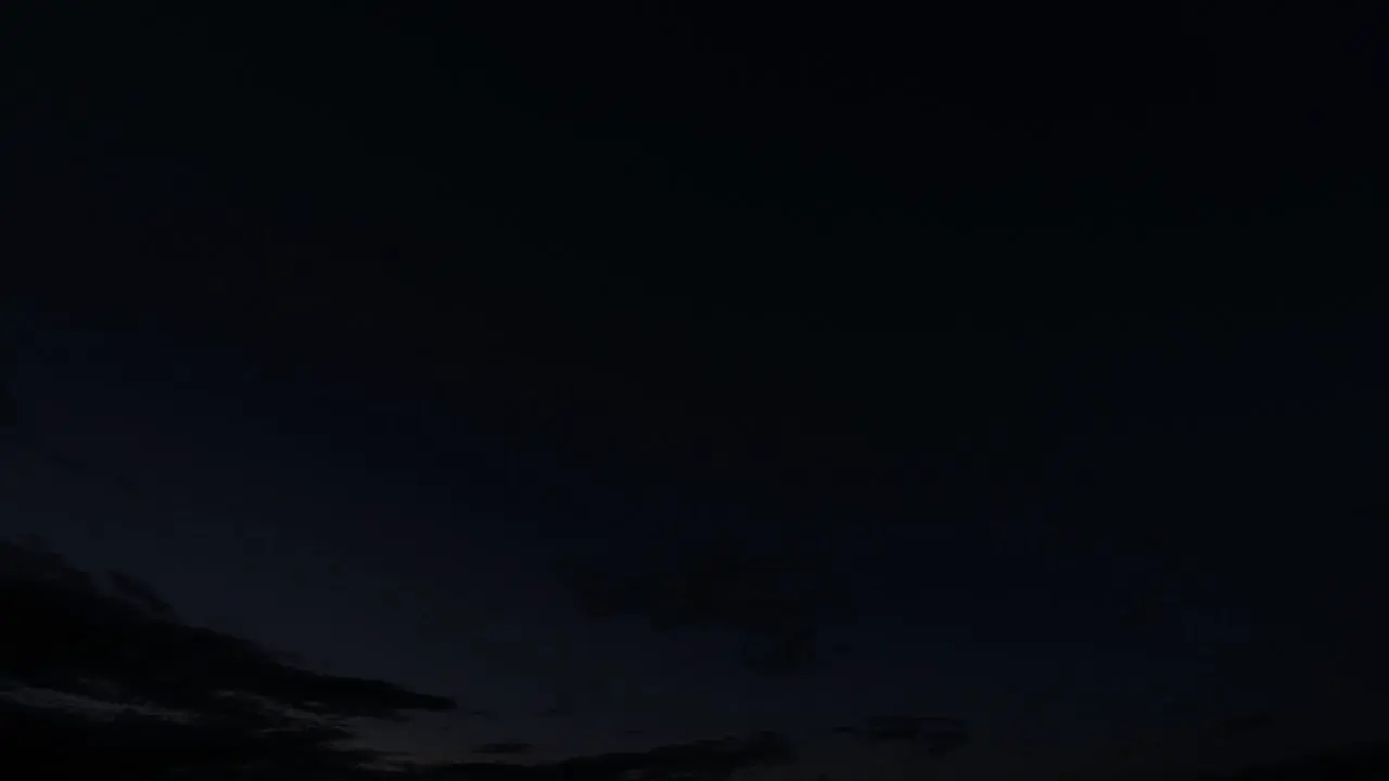 Time lapse of clouds moving in the sky from evening to morning