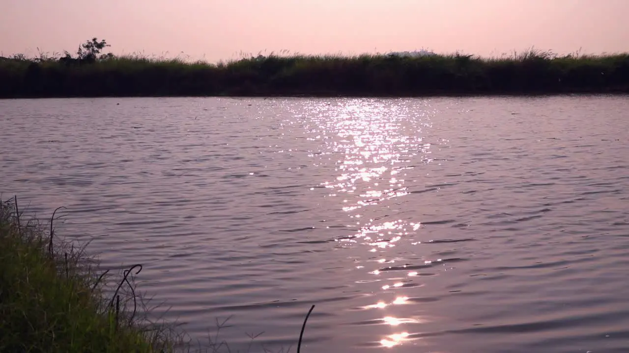 Sun Reflecting on the Water at Sunset in the Countryside