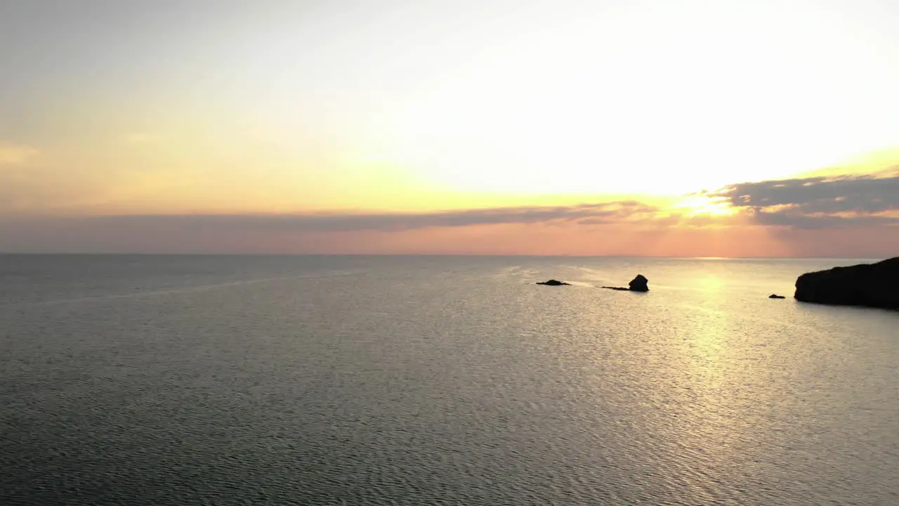 Aerial panning footage of sunrise over sea and seashore  Bulgaria