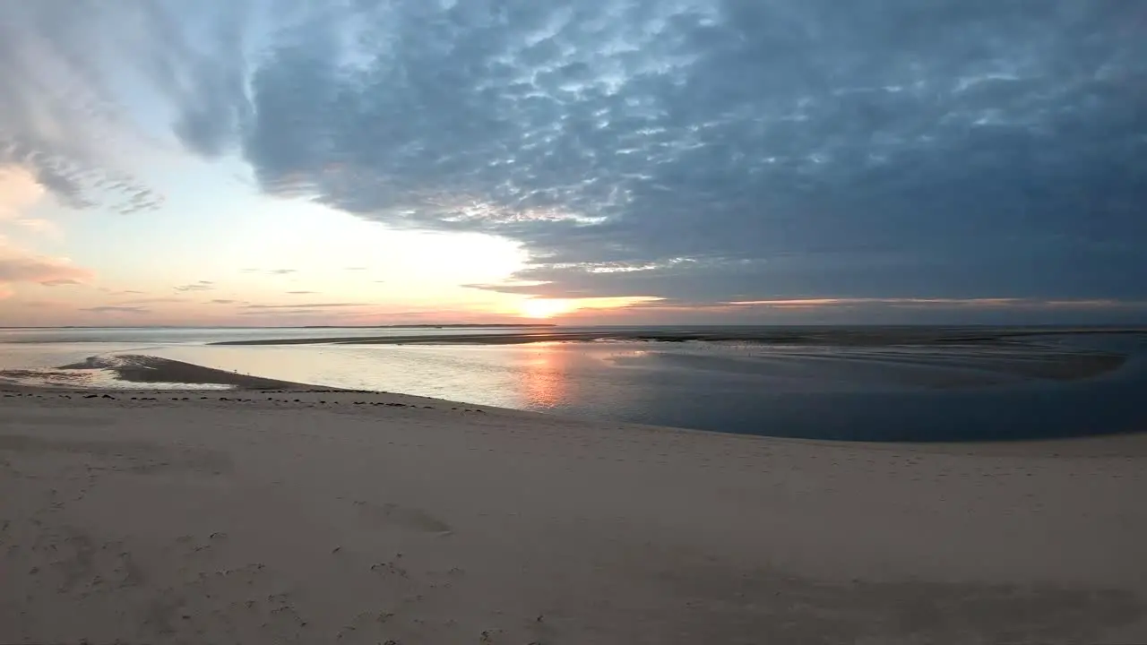 Aerial footage flying at the sunset by the ocean