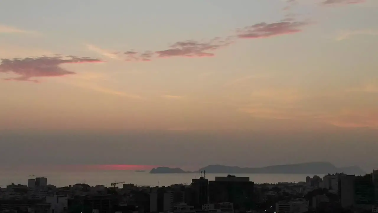 Soft pink timelapse cityscape from Miraflores looking to San Lorenzo island sunset