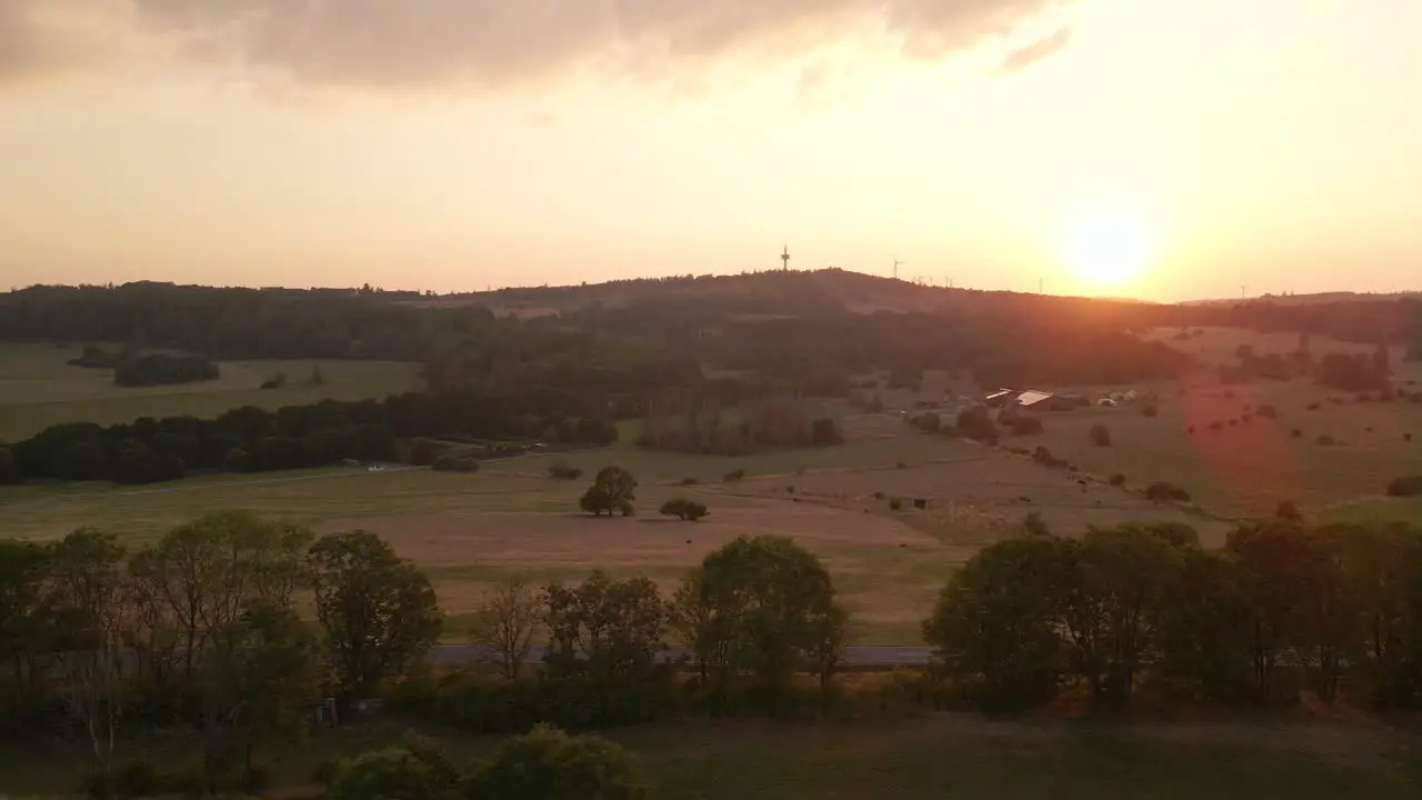 Sideways Dolly Shot Of A Sunset Over A Hill Where A Wildfire Took Place Overnight In Germany