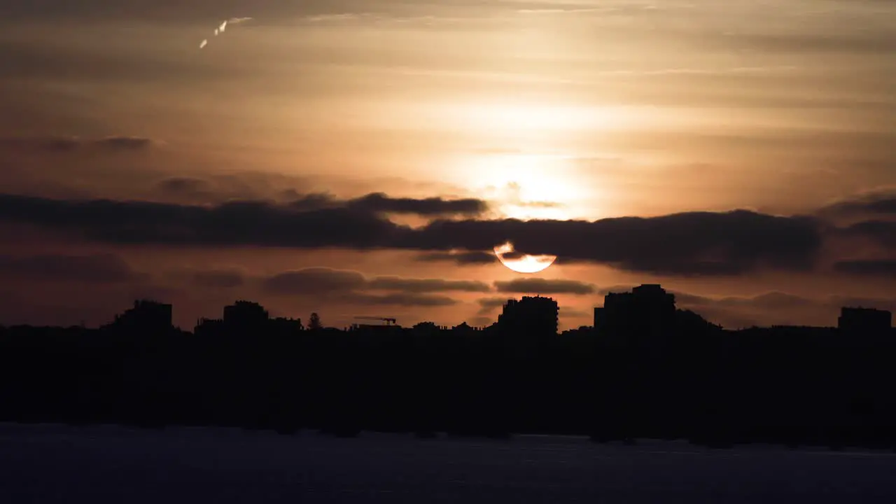 Silhouette of city with beautiful sunset on background