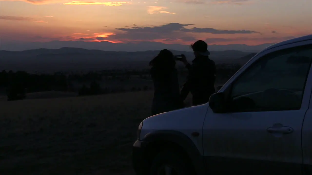 A Couple watching a Beautiful Sunset Together