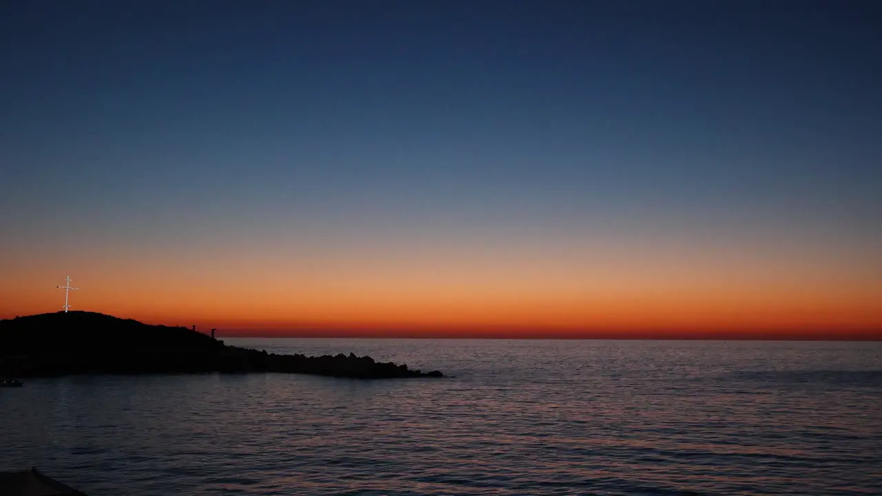 Christian Cross on Lebanon Coast with Beautiful Mediterranean Sunset