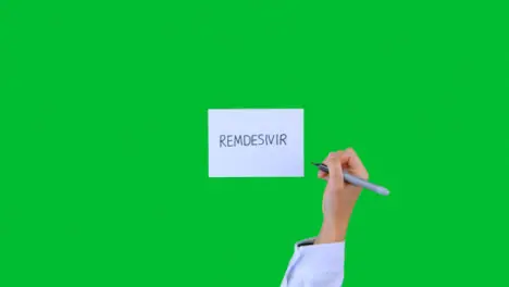 Doctor Writing Remdesivir on Paper with Green Screen