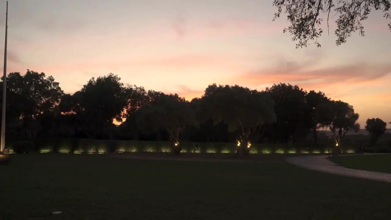 Static Shot At Sunset Of Golf Court Surrounded With Green Trees Cadiz Spain