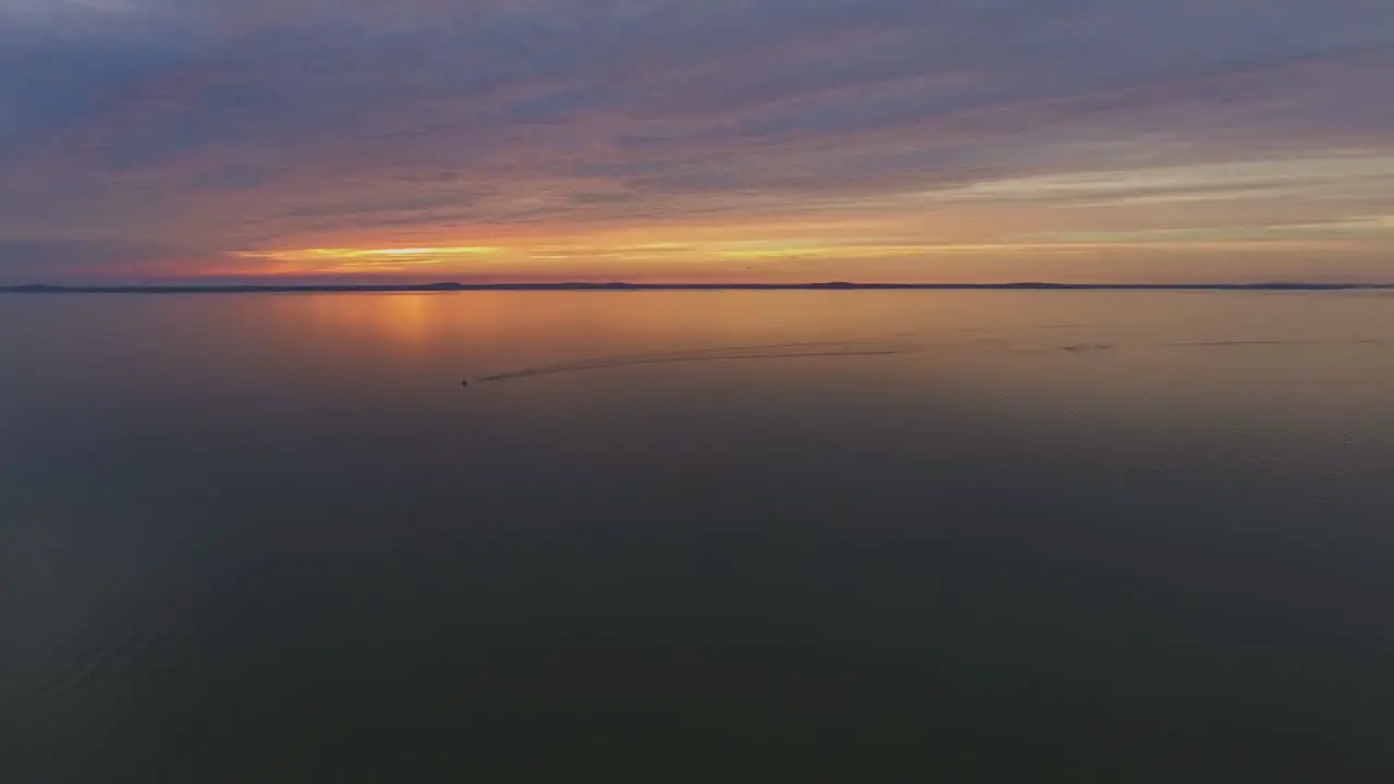 Motor Boat Yacht Sailing Through the Curonian Lagoon During Sunset