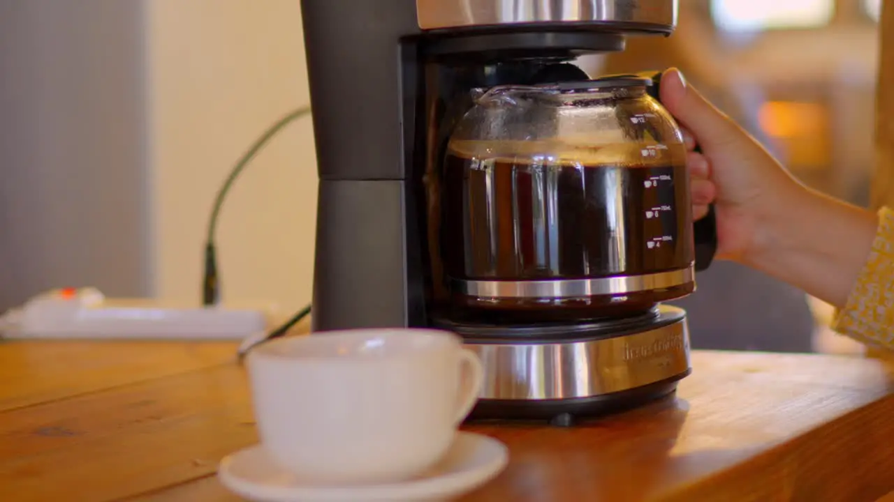 grain coffee being served in a white cup