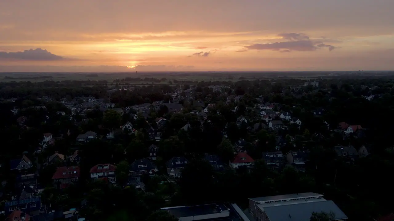 Jib up over small rural town at sunrise