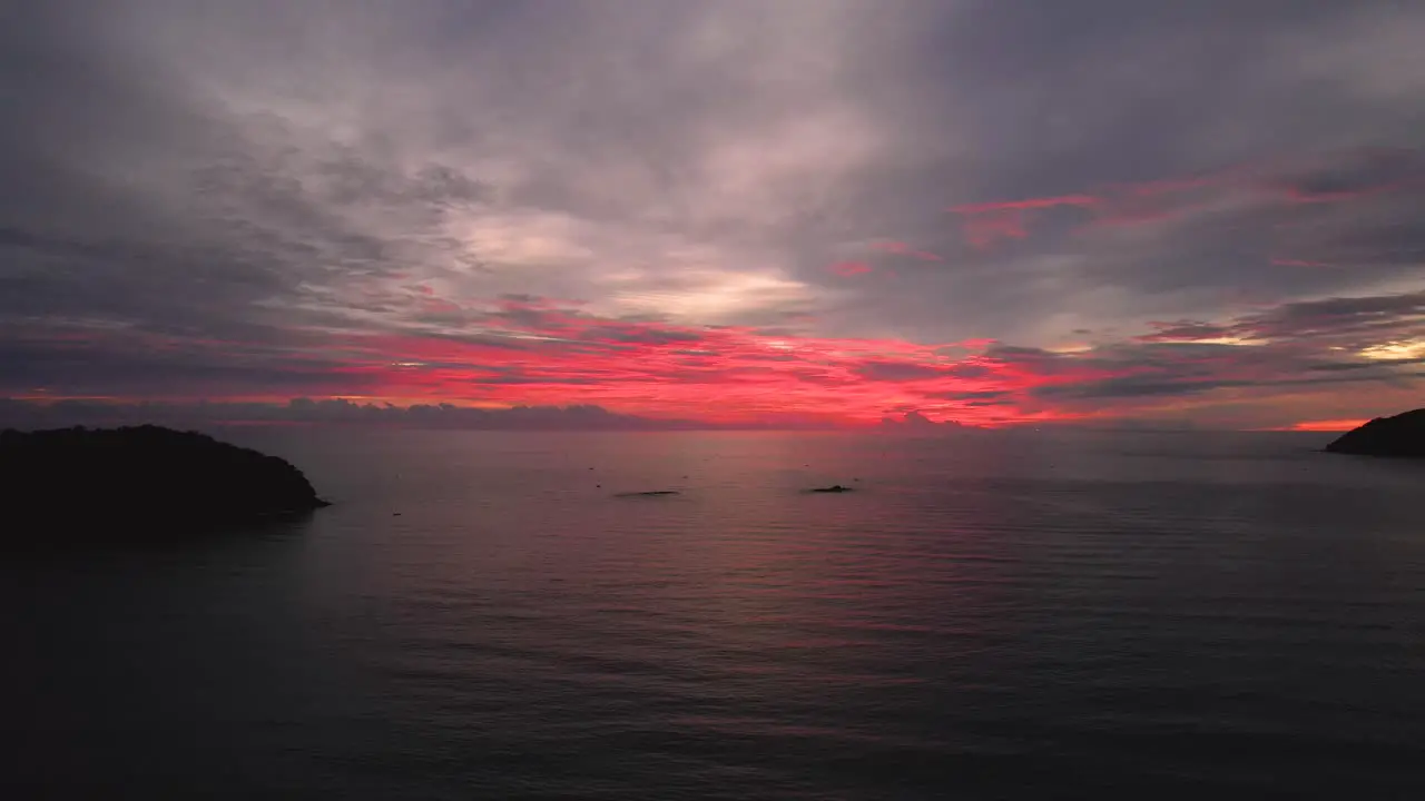 Dolly shot of the vibrant sunset setting over Pentai Tengah Beach Malaysia