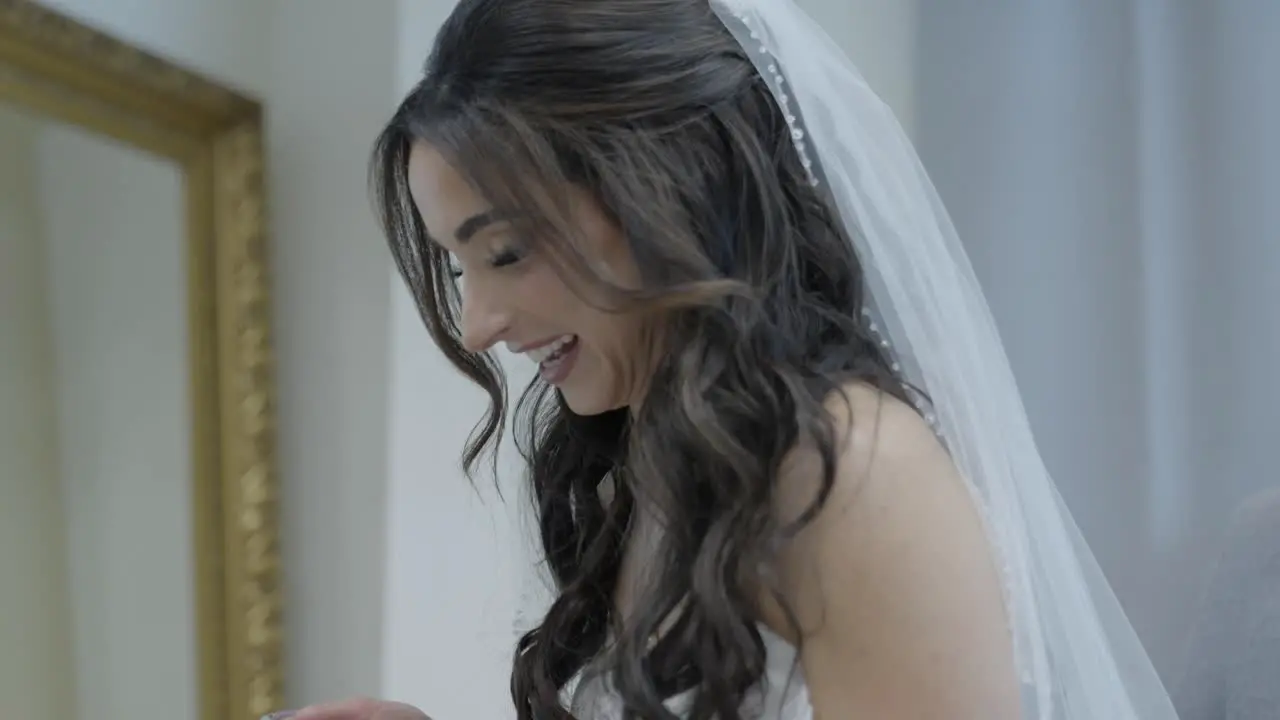 Bride reacting to video from Groom Blushing