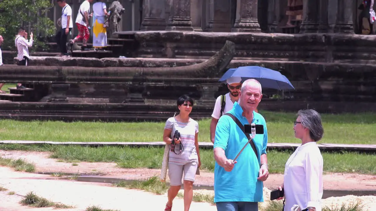 Tourists Taking a Selfie in Angkor Wat