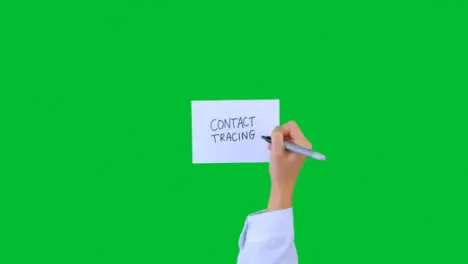 Doctor Writing Contact Tracing on Paper with Green Screen