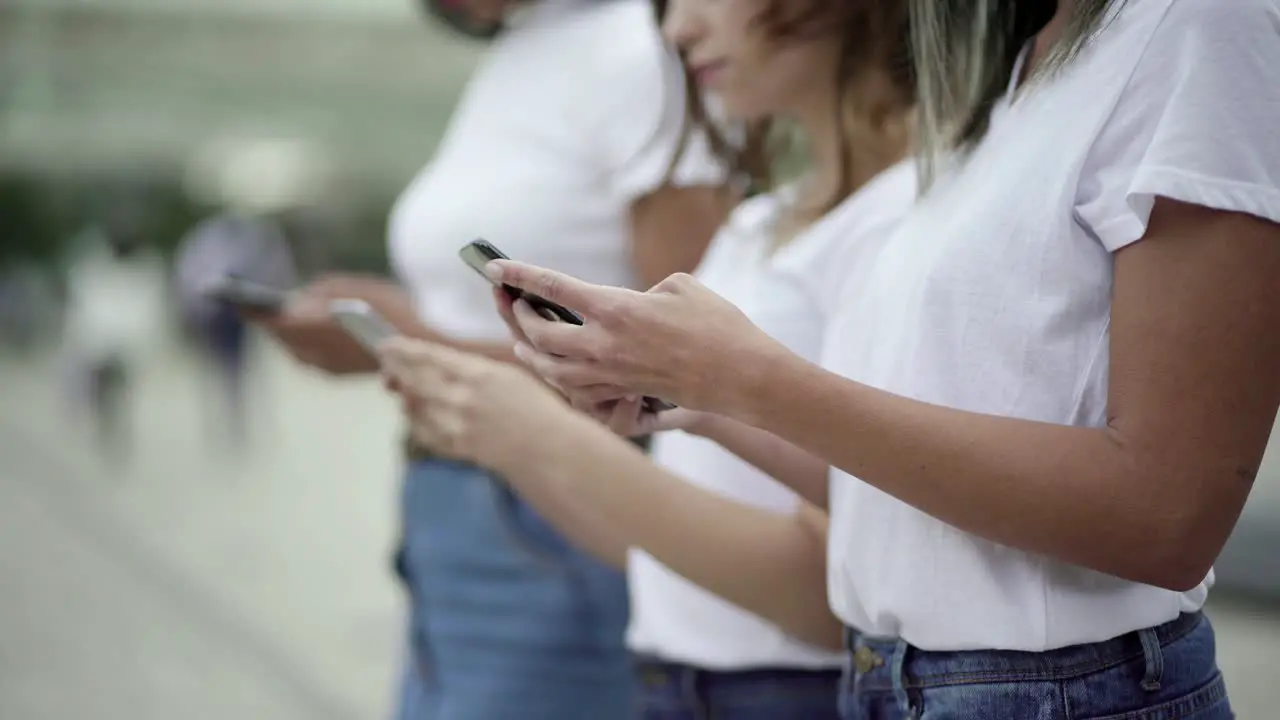 Cropped shot of young woman using modern phone