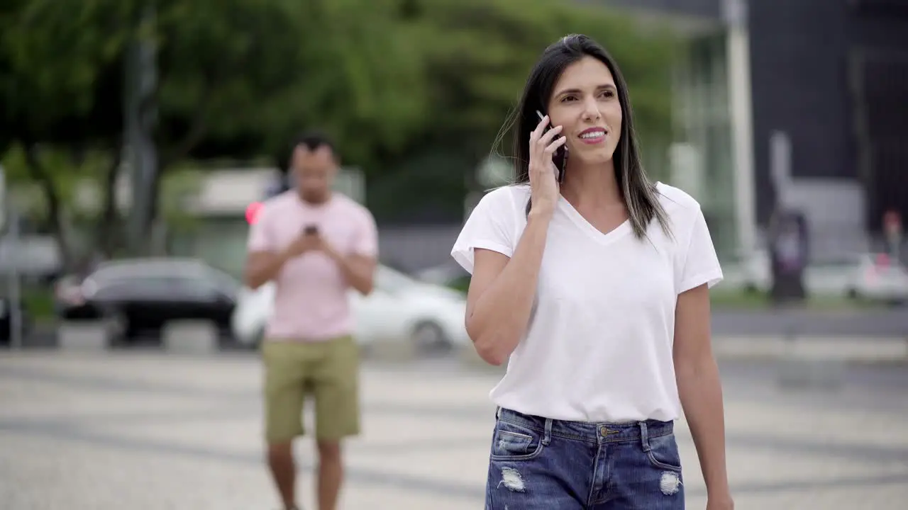 Relaxed young woman talking on smartphone