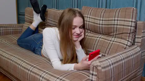 Joyful girl reading good news enjoy success shopping celebrating lottery victory on mobile phone