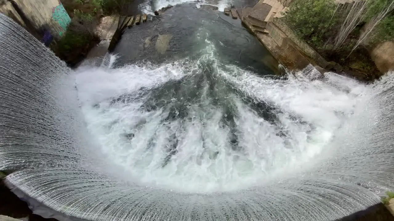 Top view of a dam with a waterfall in proença a nova Portugal surrounded by nature