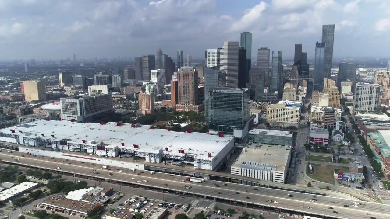 This video is of an aerial view of downtown Houston skyline on a cloudy day