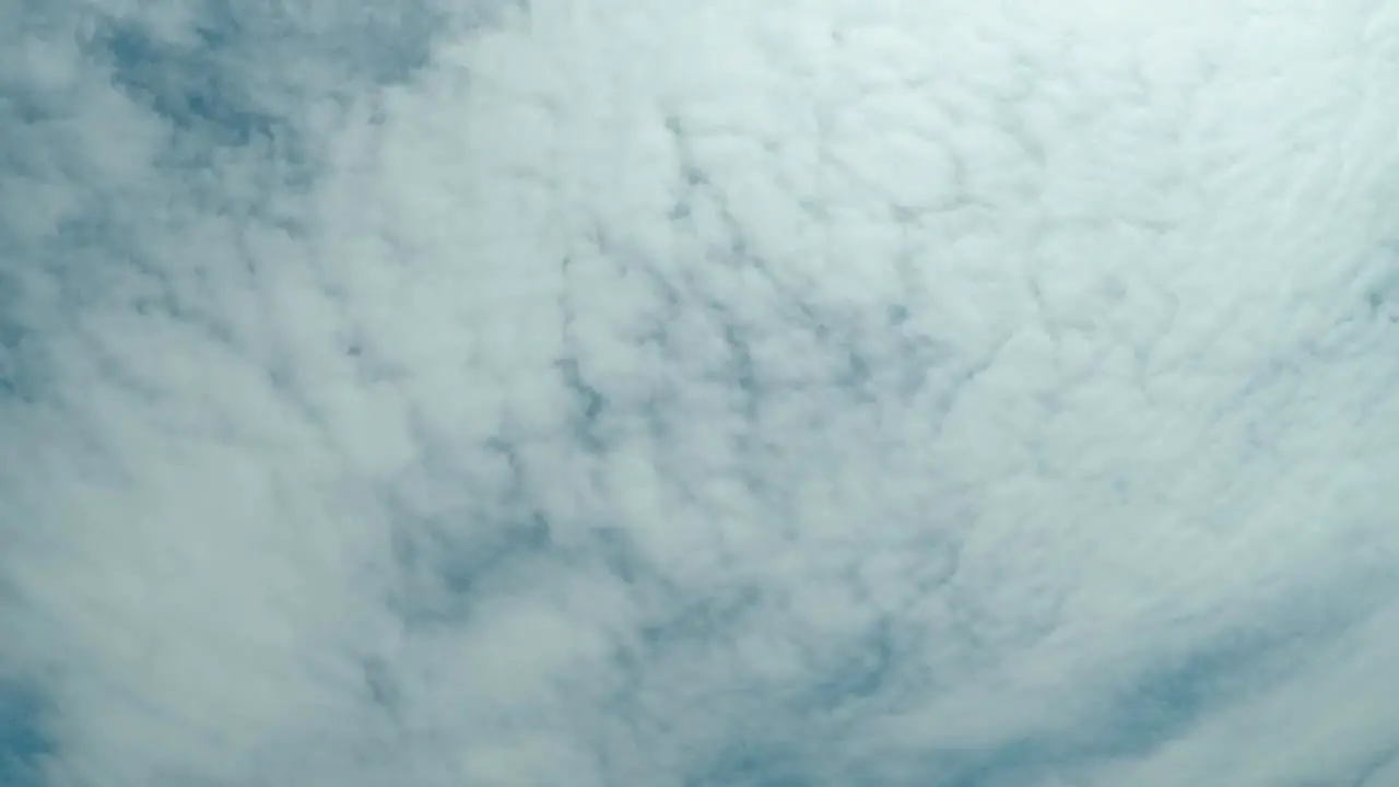 Timelapse of clouds moving overhead on a partly cloudy day