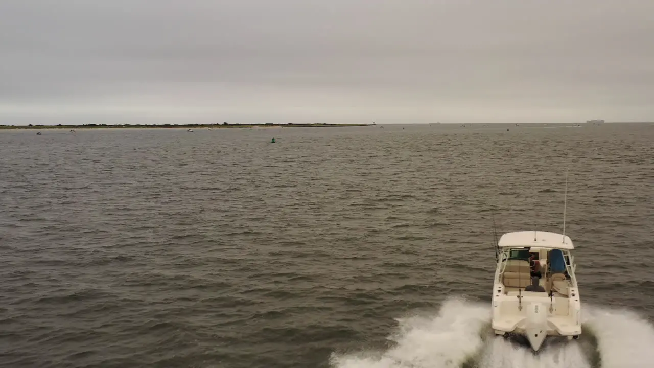 An aerial view of a fishing boat speeding out in the Atlantic Ocean near Long Island NY