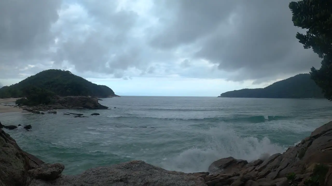 Dramatic time lapse on a cloudy day at Trindade beach Rio de Janeiro Brazil