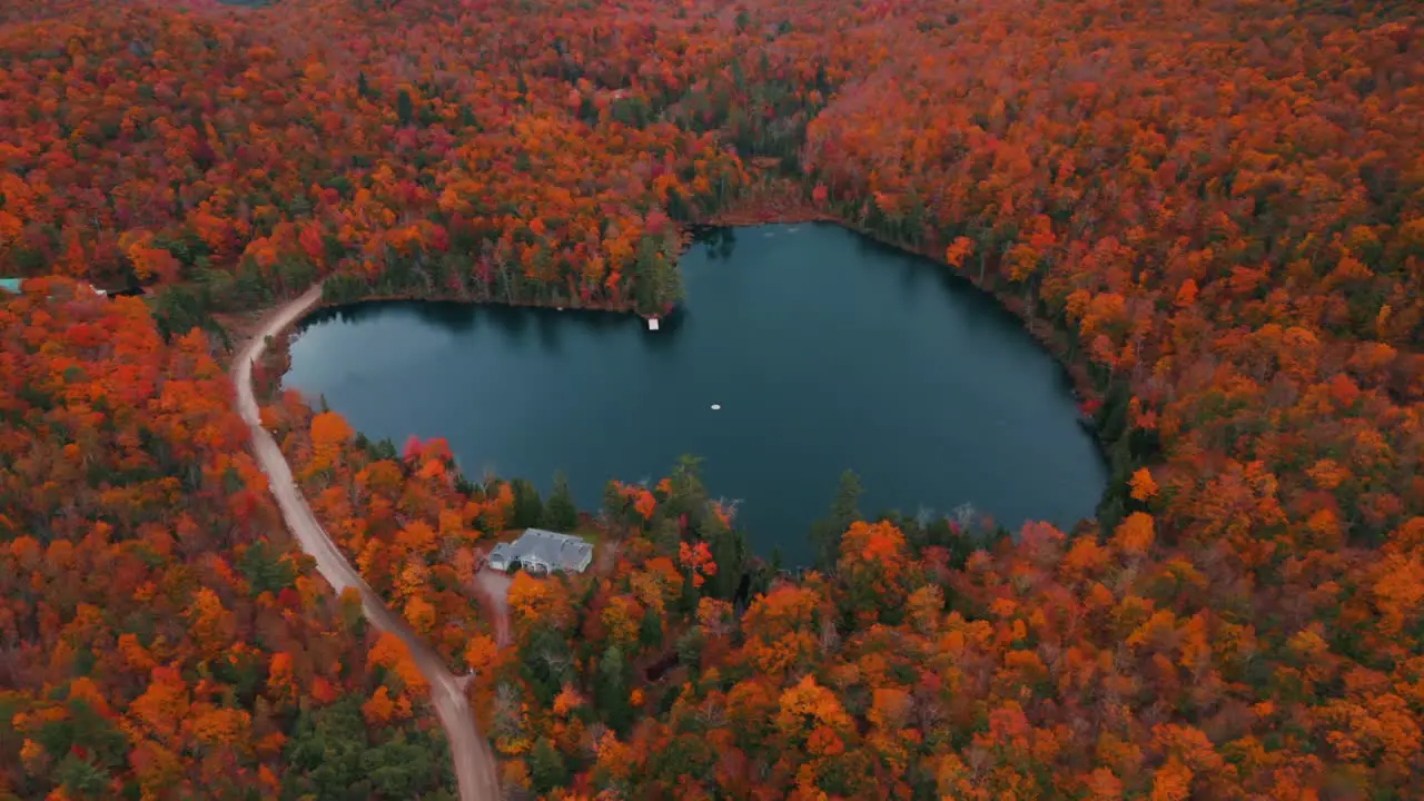 drone shot around the famous heart shaped lake during fall in Quebec Canada