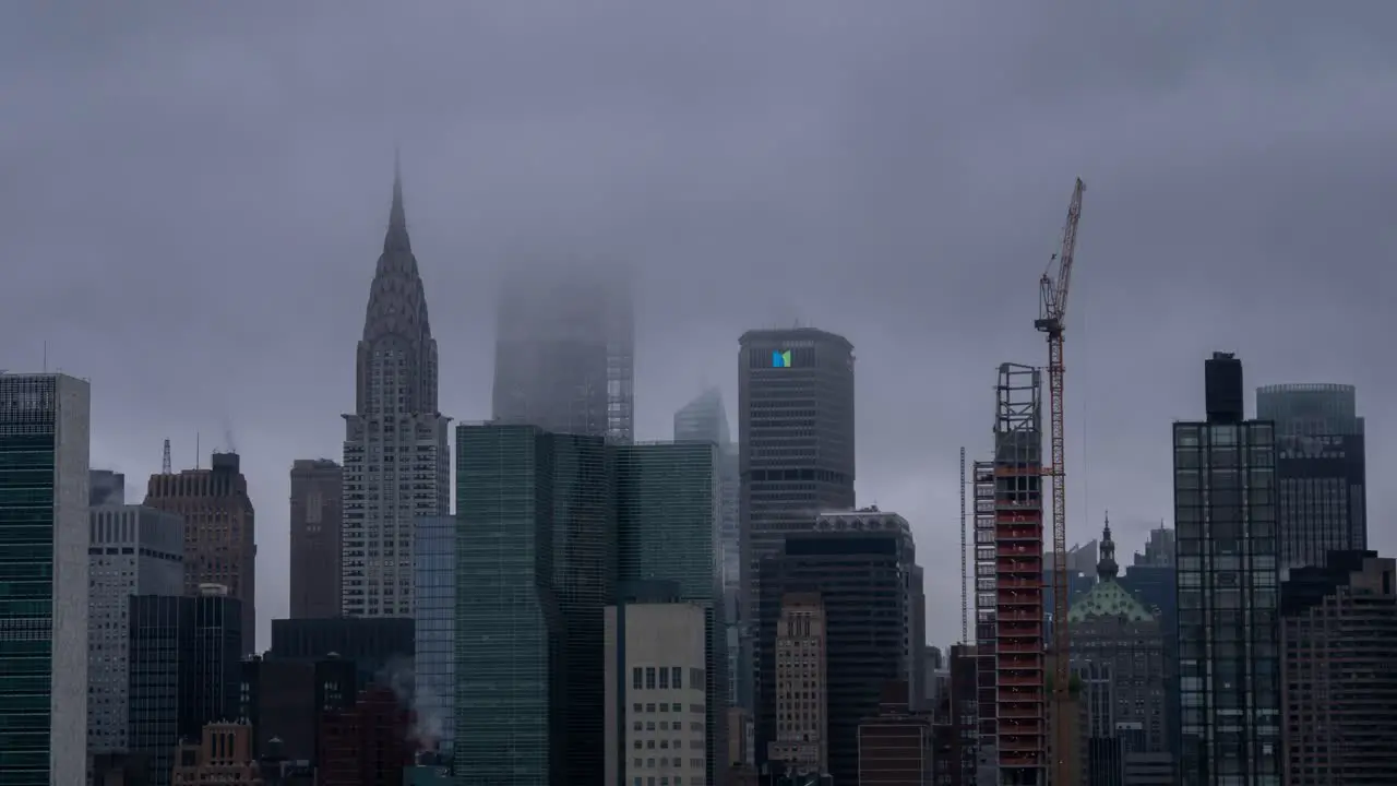 Time Lapse of clouds over the skyscrapers and new buildings under construction at East Side Manhattan New York City USA