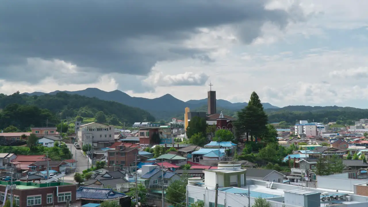 Timelapse Of Clouds Moving Over Residential Houses With Church At Geumsan County In South Chungcheong Province South Korea