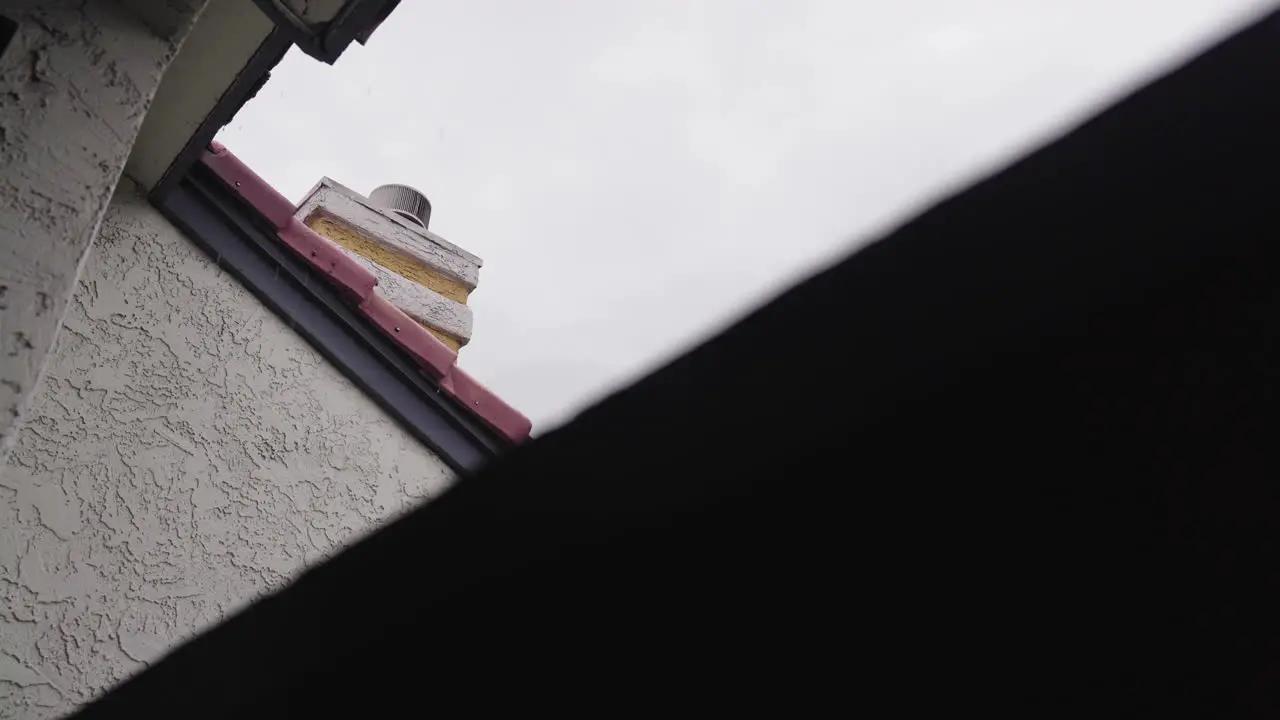 View of Chimney in the Rain from Apartment Building Balcony