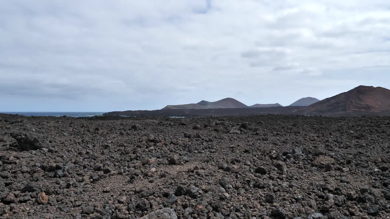 Black lava landscape on cloudy day