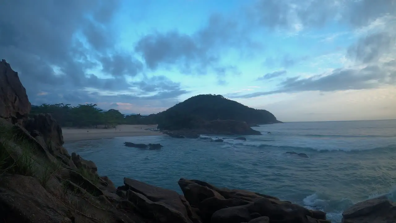 Time lapse of a sunset on a cloudy day at Trindade beach Rio de Janeiro Brazil