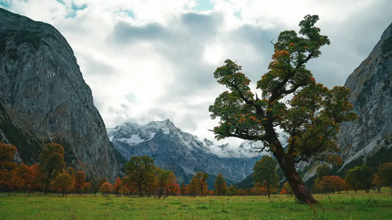 4K UHD time lapse of moving clouds in Austrias famous alps mountains area Ahornboden Hinterriss close to the German border in Autumn weather with colorful maple trees