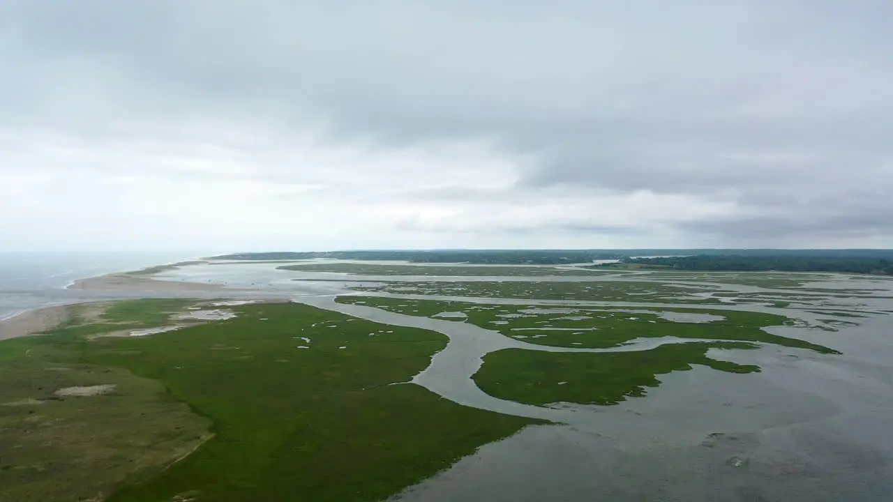 Ominous Aerial Drone Footage Marsh and Ocean on Dark Cloudy Day in Cape Cod Massachusetts