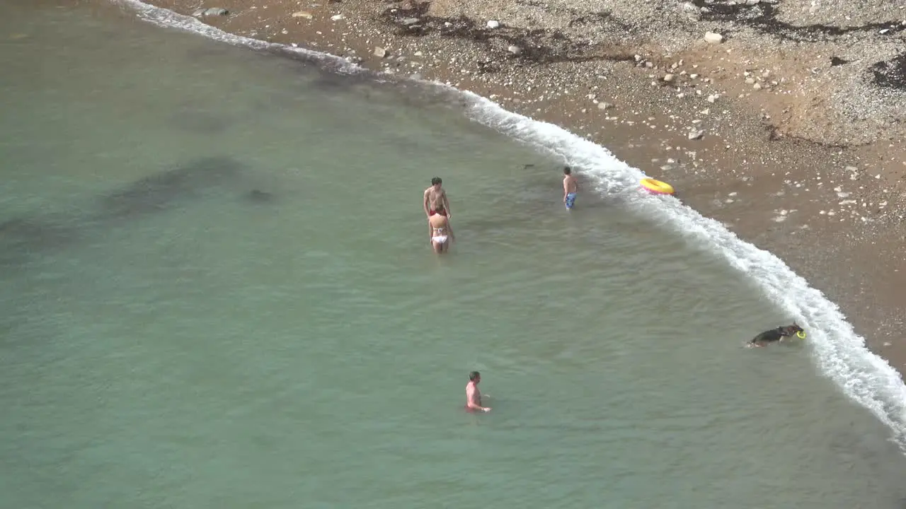 Over head view of some people swimming in the cold water of the sea