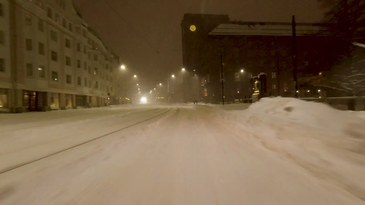 POV shot driving through downtown Helsinki after a heavy snowstorm